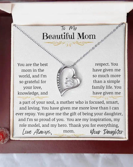 a yellow gold forever love necklace up close in mahogany box