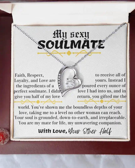a white gold forever love necklace up close in a mahogany box