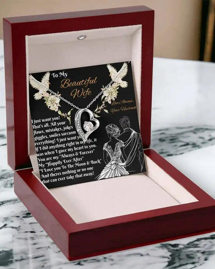 white gold forever love necklace in a mahogany box angled left