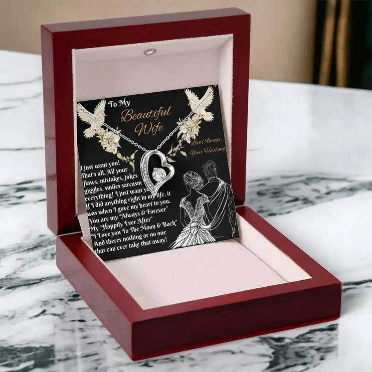 white gold forever love necklace in a mahogany box angled left