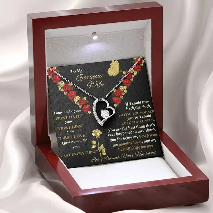 white gold forever love necklace in mahogany box on white fabric