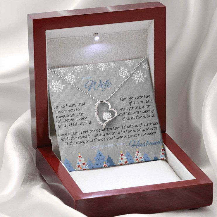 white gold forever love necklace in luxury box on white cloth back drop