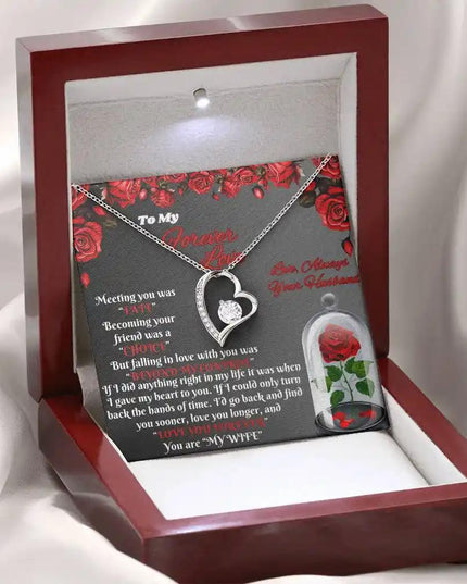 white gold forever love necklace in mahogany box angled left