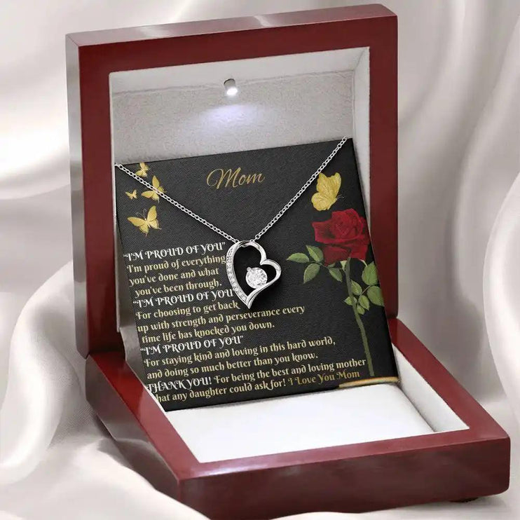 white gold forever love necklace in mahogany box angled left