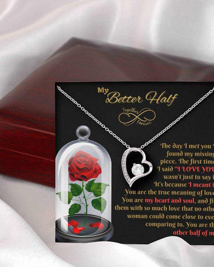 white gold forever love necklace outside a closed luxury box