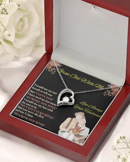 white gold forever love necklace in mahogany box angled right