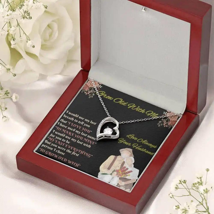 white gold forever love necklace in mahogany box angled right