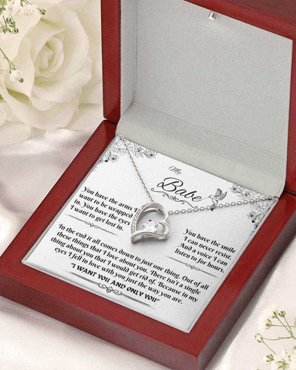 white gold forever love necklace in a luxury box angled to the right