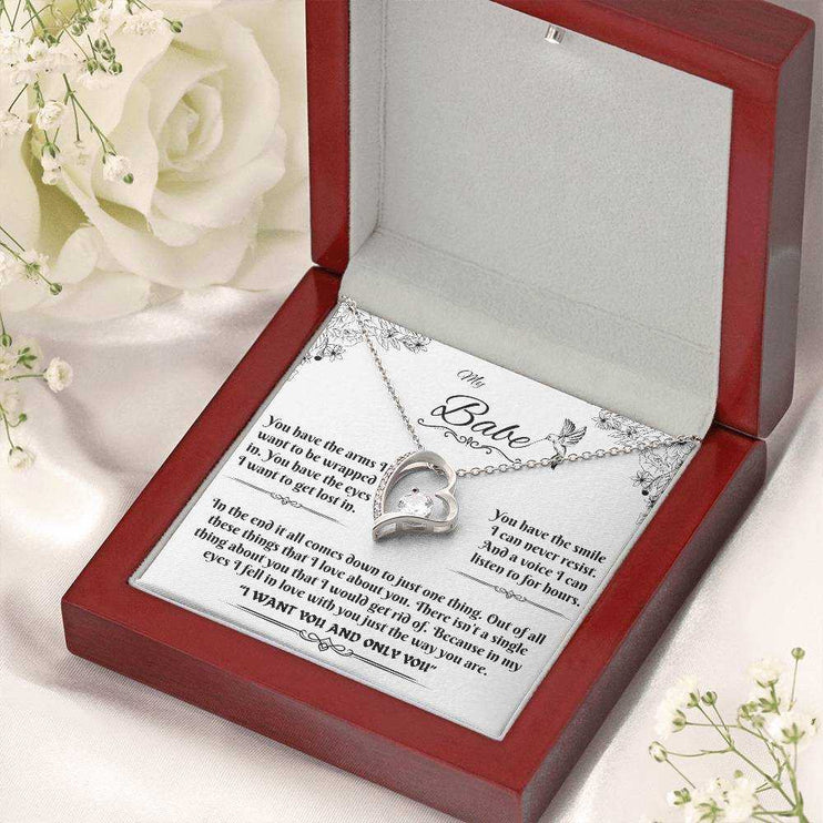 white gold forever love necklace in a luxury box angled to the right