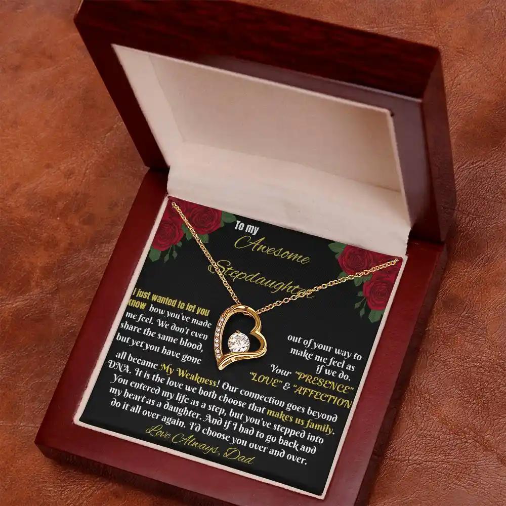 yellow gold forever love necklace in a mahogany box angled right