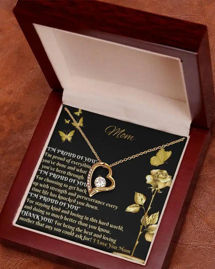 yellow gold forever love necklace in mahogany box angled right