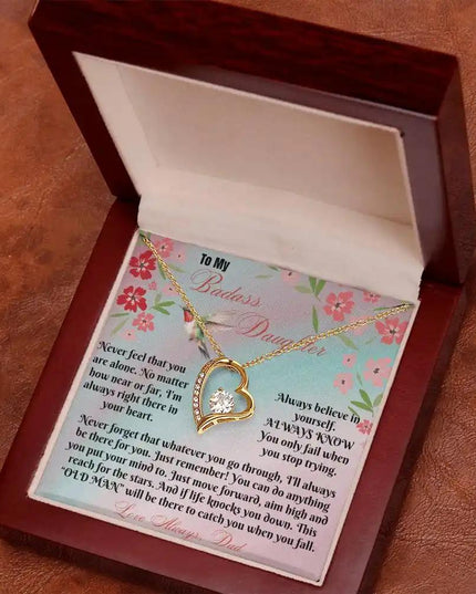 yellow gold forever love necklace in mahogany box angled right