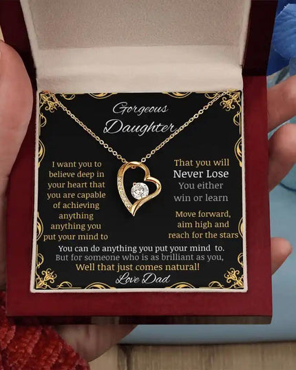 Forever Love Necklace in a mahogany box in a hand angled away
