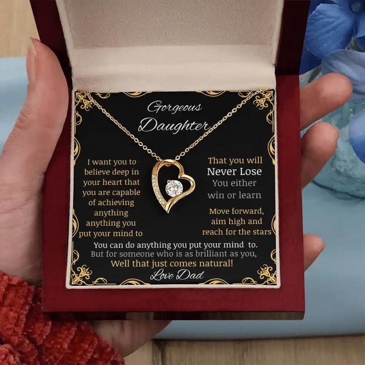 Forever Love Necklace in a mahogany box in a hand angled away