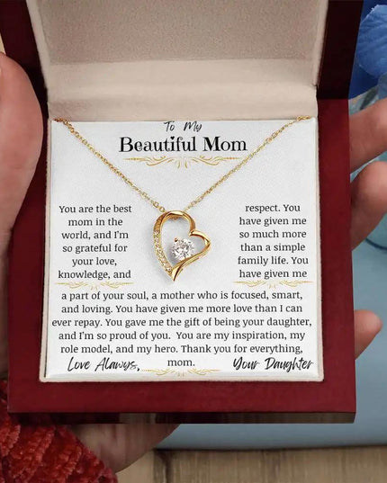 a yellow gold forever love necklace up close in models hand
