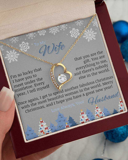 yellow gold forever love necklace in luxury box in model's hand