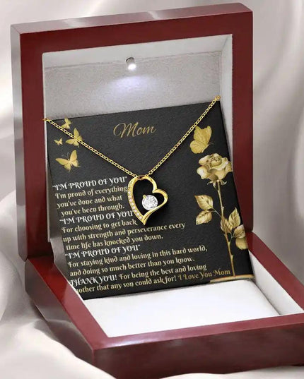 yellow gold forever love necklace in mahogany box angled left