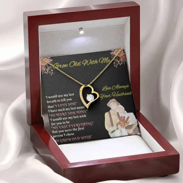 yellow gold forever love necklace in mahogany box