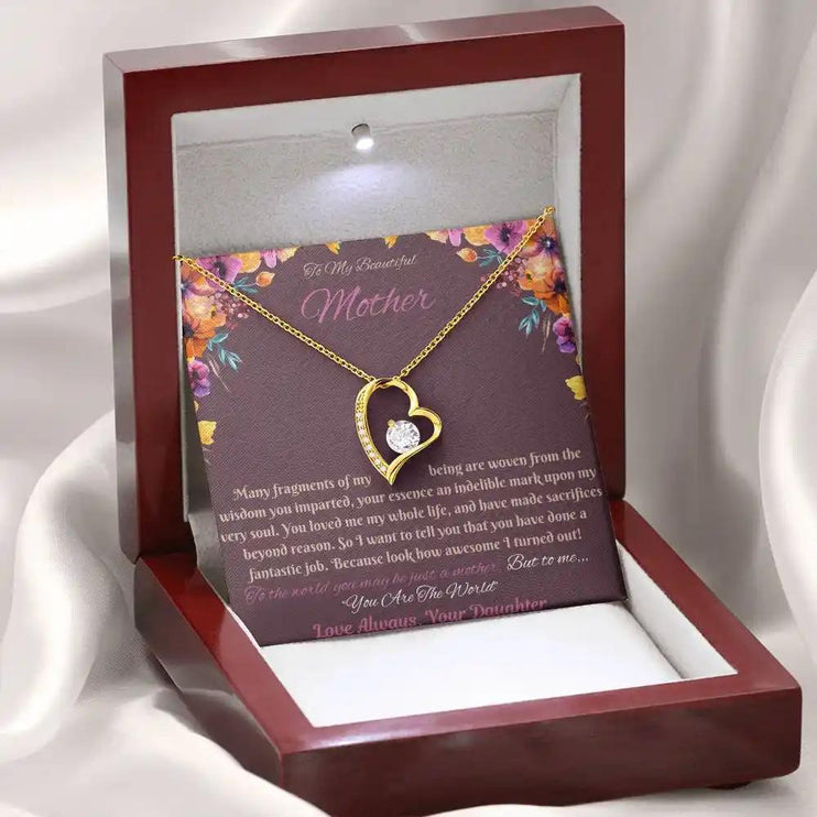 yellow gold forever love necklace in mahogany box angled left