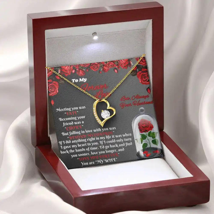 yellow gold forever love necklace in mahogany box angled left