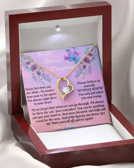 yellow gold forever love necklace in mahogany box angled left