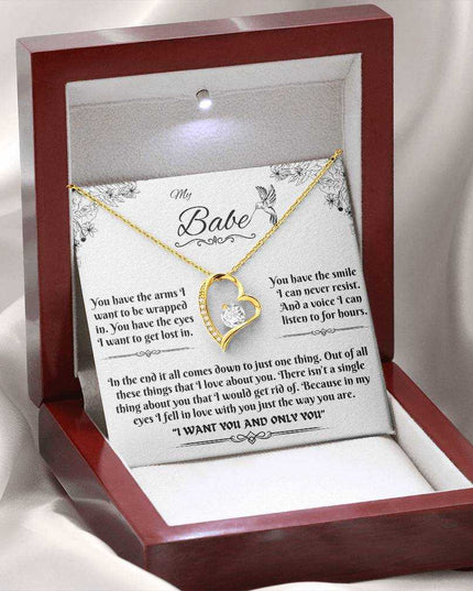 yellow gold forever love necklace in a luxury box with LED light on