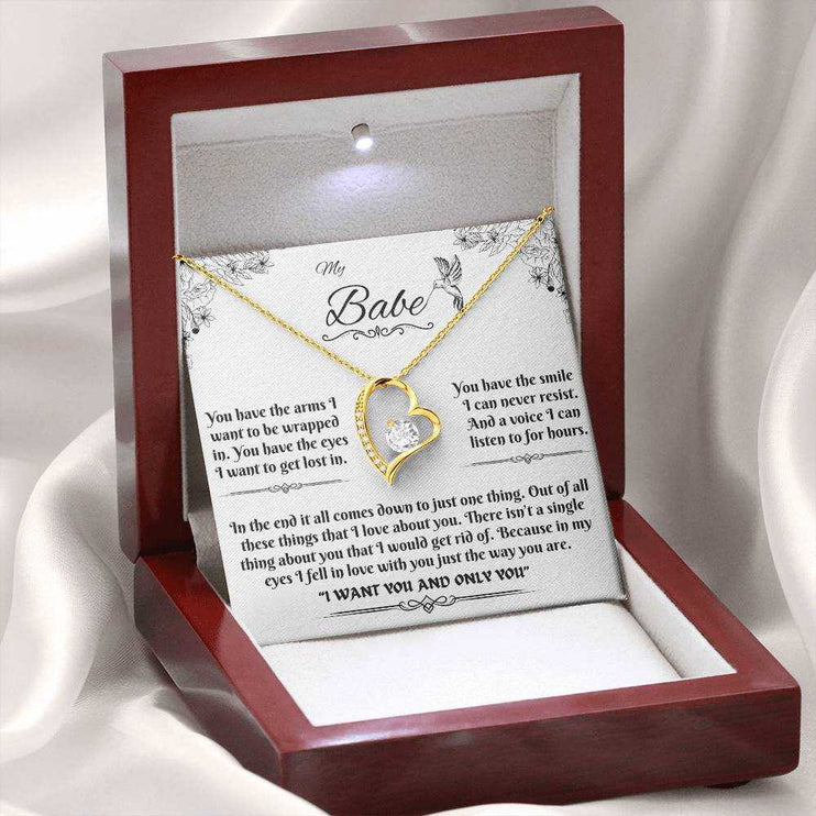 yellow gold forever love necklace in a luxury box with LED light on