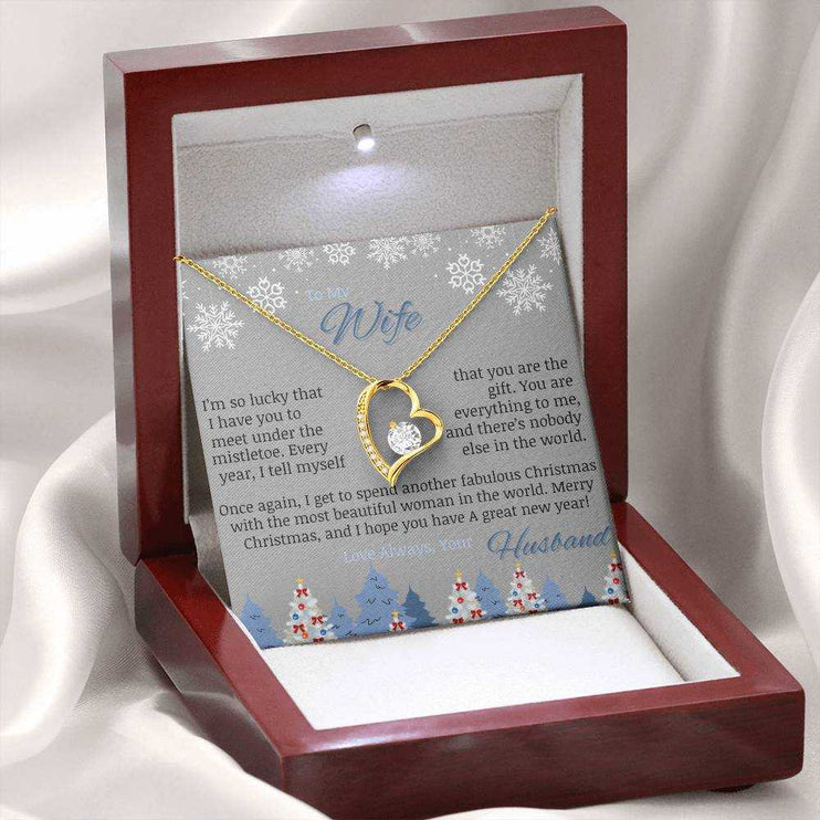 yellow gold forever love necklace in luxury box on white felt cloth