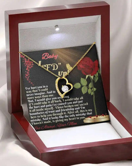yellow gold forever love necklace in mahogany box angled left