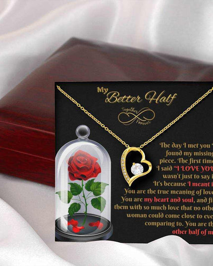 yellow gold forever love necklace outside of closed luxury box