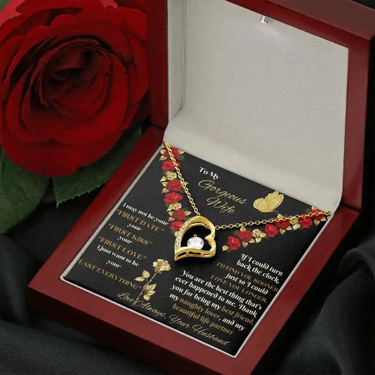 yellow gold forever love necklace in mahogany box angled right