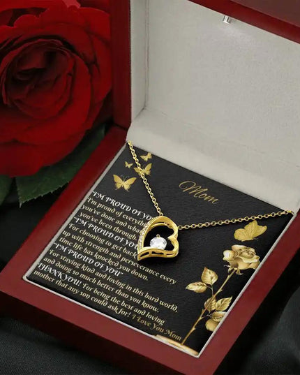 yellow gold forever love necklace in mahogany box angled right