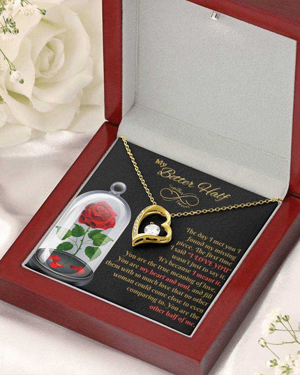 yellow gold forever love necklace in a luxury box with white roses