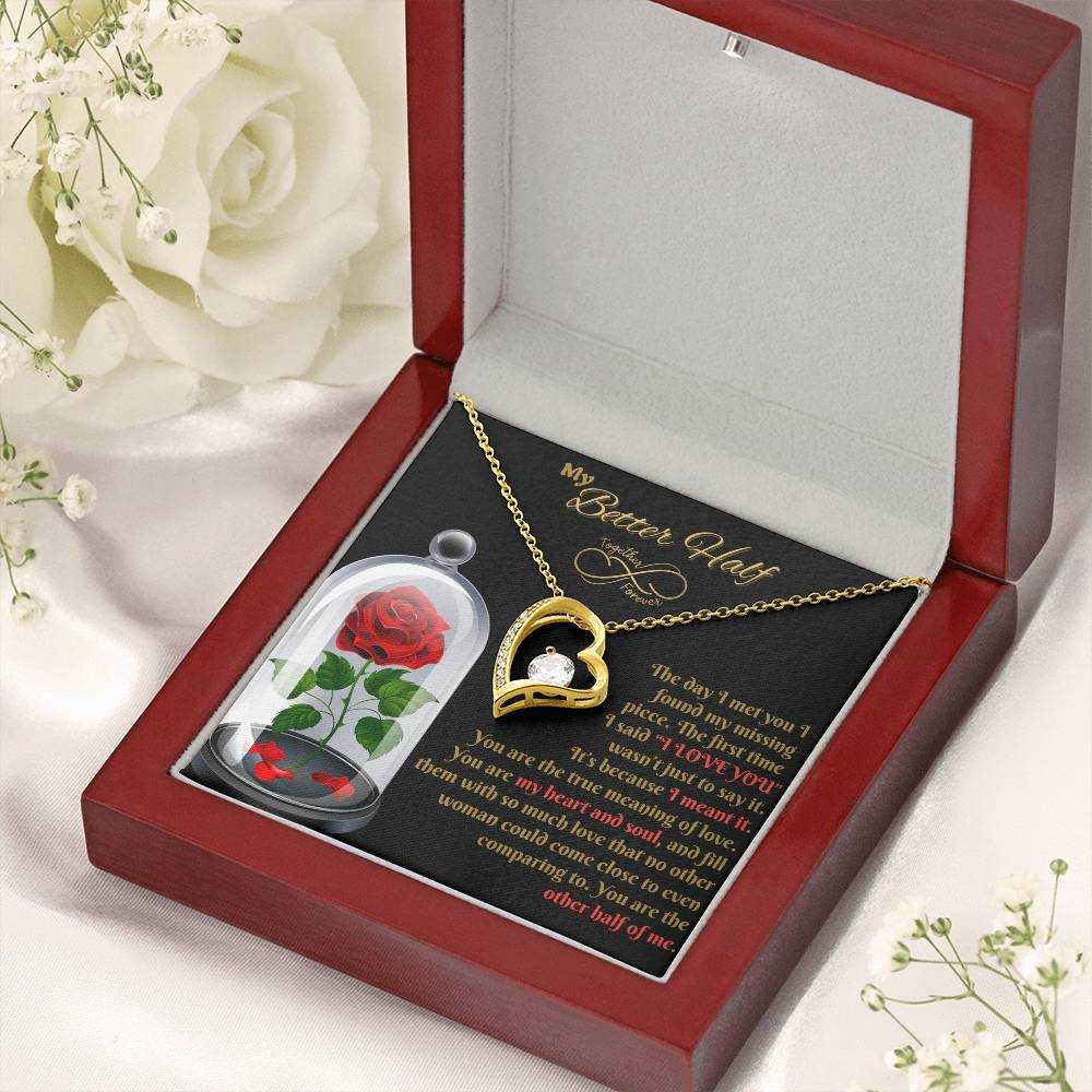 yellow gold forever love necklace in a luxury box with white roses