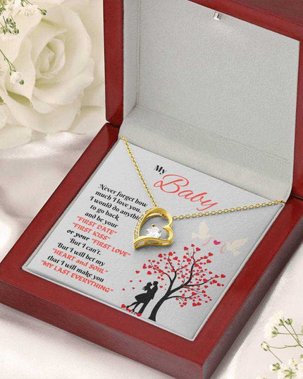 yellow gold forever love necklace in a luxury box angled right