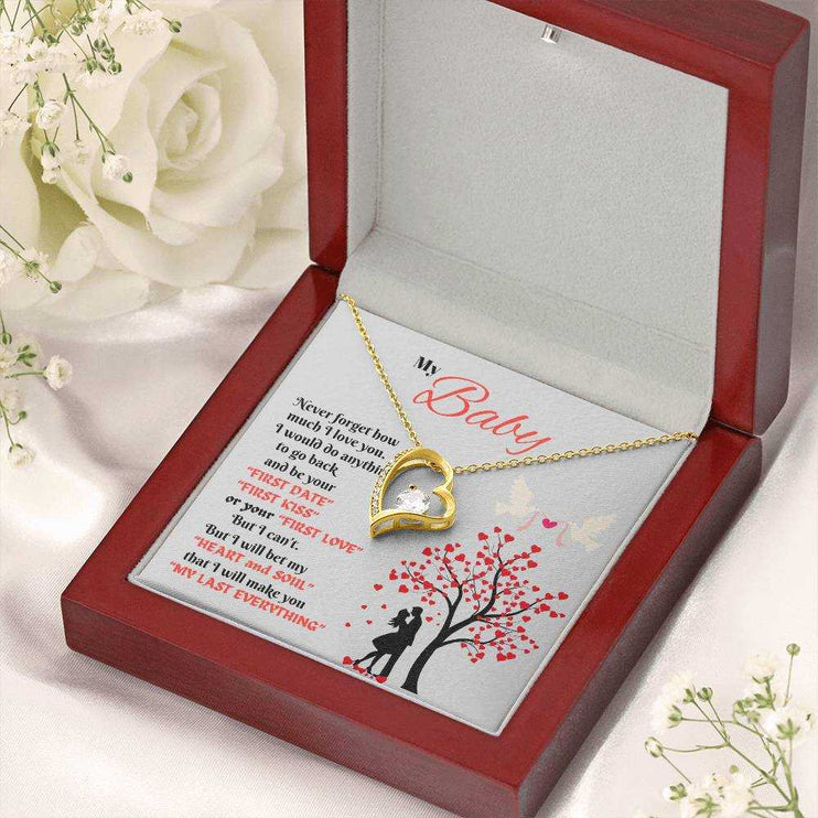 yellow gold forever love necklace in a luxury box angled right