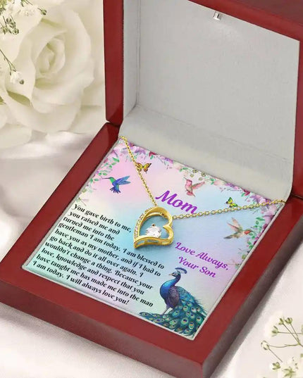 yellow gold forever love necklace in mahogany box angled right