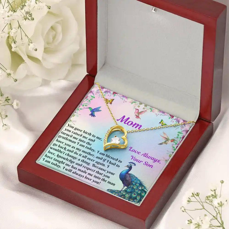 yellow gold forever love necklace in mahogany box angled right