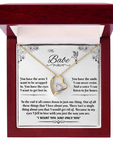 yellow gold forever love necklace in a luxury box up close
