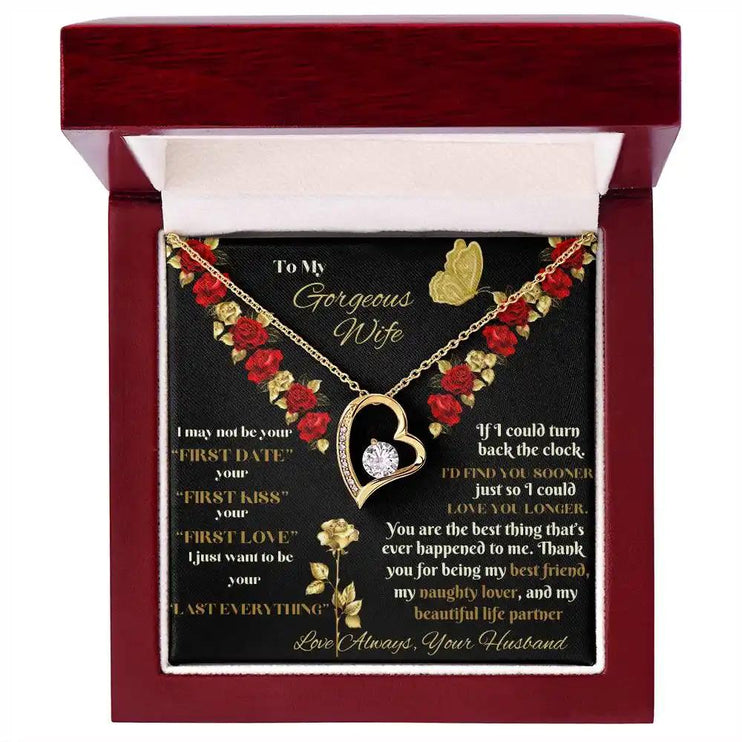 yellow gold forever love necklace in mahogany box top view