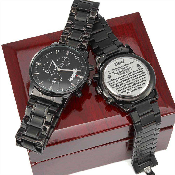 chronograph watch engraved x2 on top of a closed luxury box