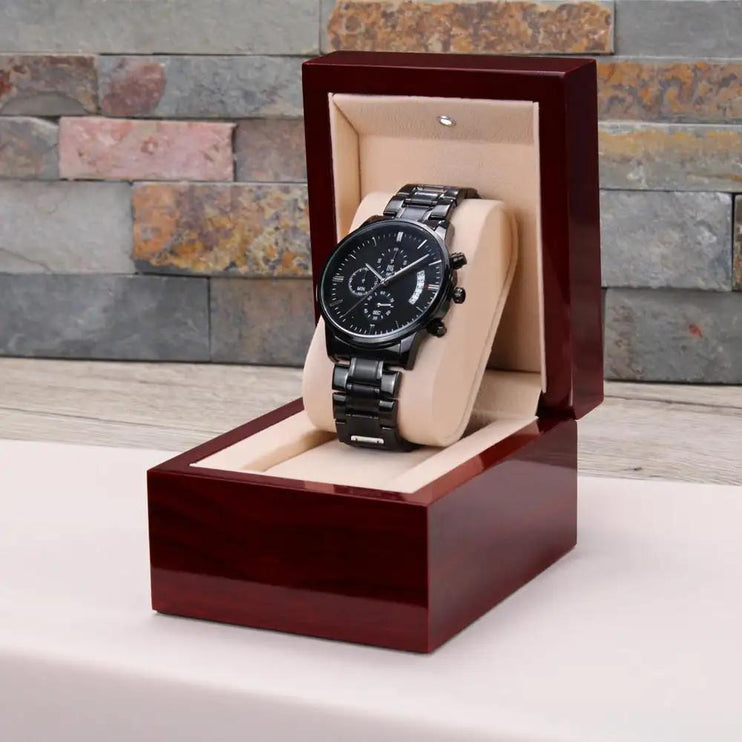 engraved chronograph watch in mahogany box right angled