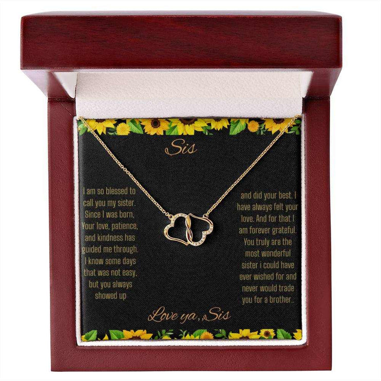 Everlasting Love Necklace with a to sis from sis greeting card inside a mahogany box with a close up view