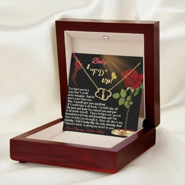 everlasting love necklace in a mahogany box angled right