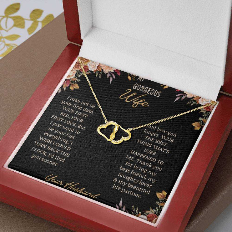  A 10k gold Everlasting Love Necklace in a mahogany box on a table with a to wife greeting card up close