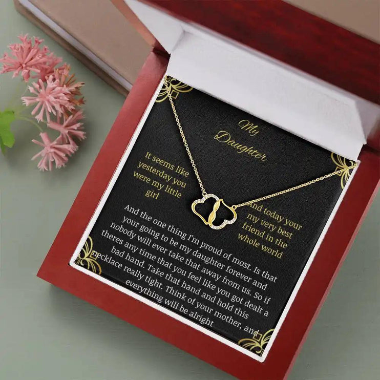 Everlasting Love Necklace in a mahogany box with a to daughter from mother greeting card angle tilted to left 