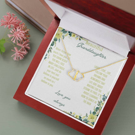 a everlasting love necklace in a mahogany box up close angled right