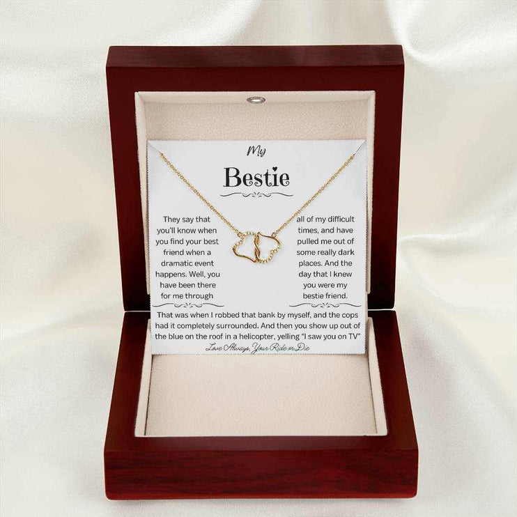 a everlasting love necklace in a mahogany box on a white cloth