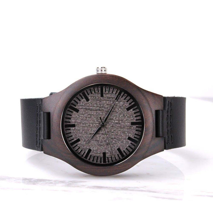 wooden watch engraved on a white backdrop