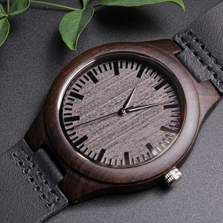 wooden watch engraved showing front up close